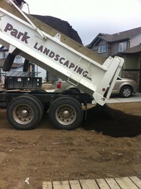 Tandem Truck Hauling - Park Topsoil